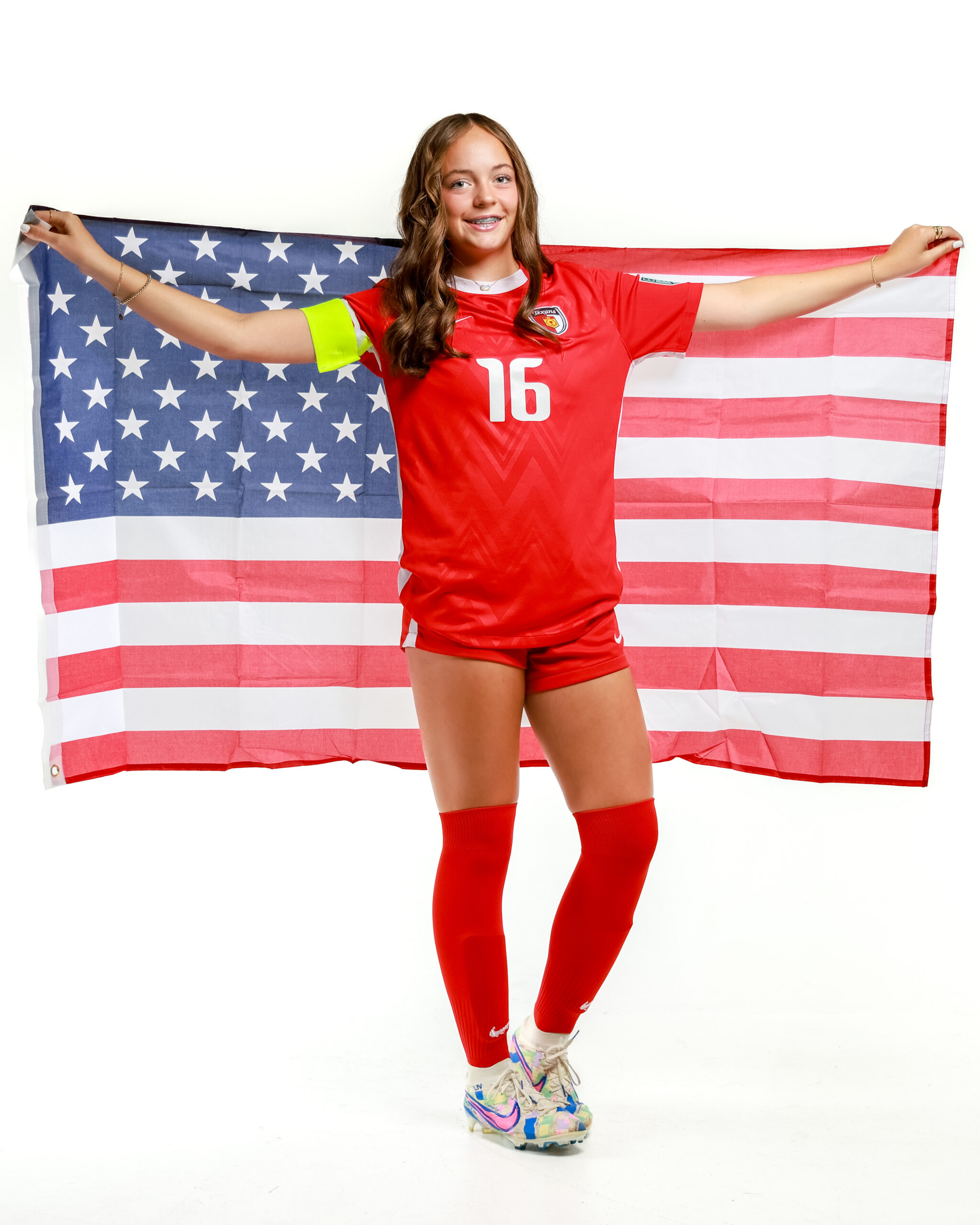 Olivia Leddy holding an American flag