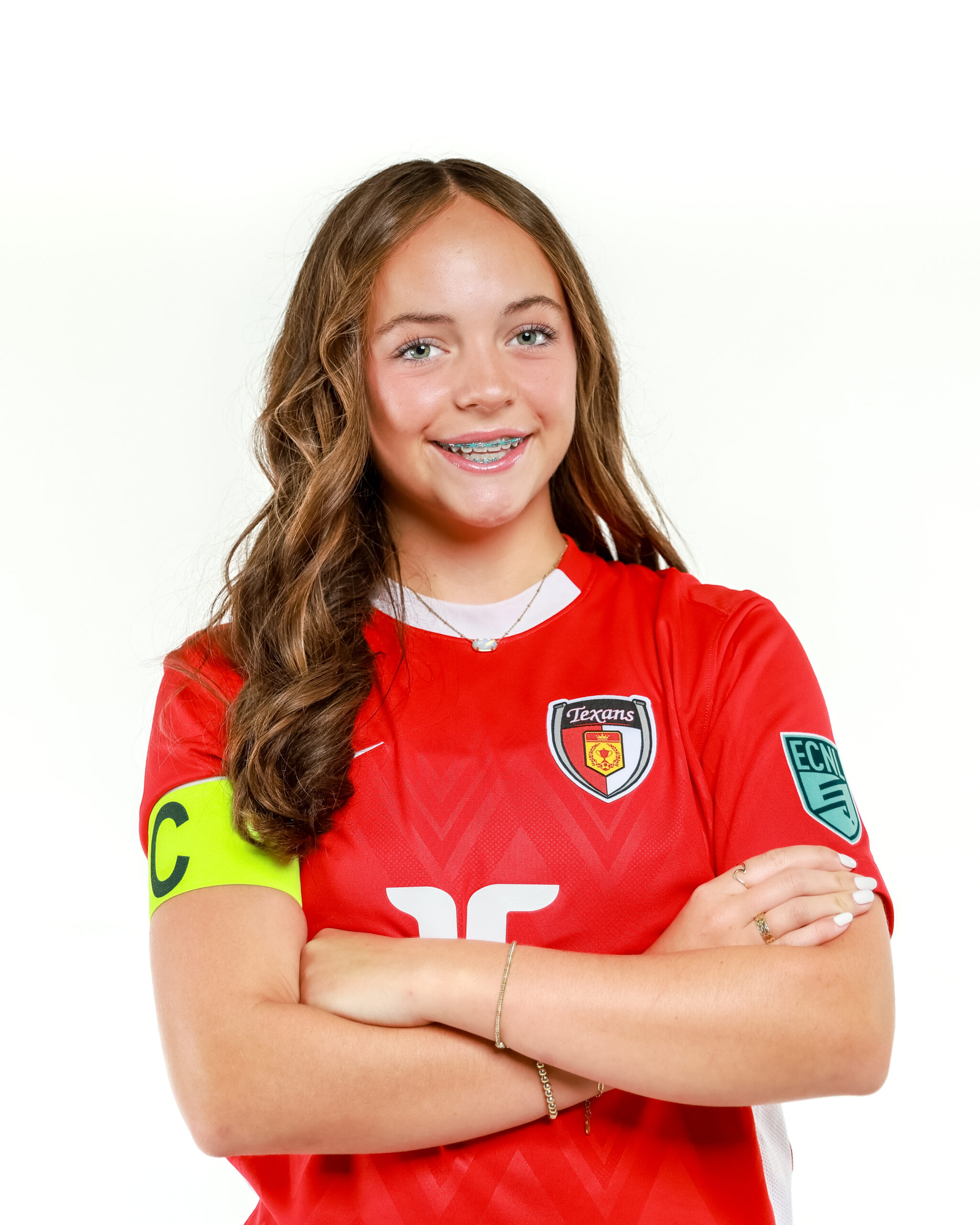 Olivia Leddy with her arms crossed wearing a captain's badge